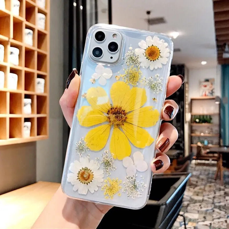 Floral patterned TPU phone case for iPhone showing large pink and yellow flower designs on back cover