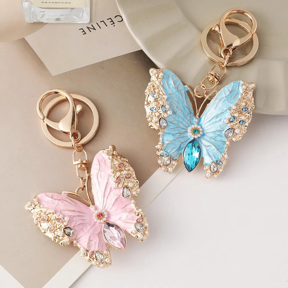 Enamel dripping oil butterfly brooch keychain in pink or blue, dual purpose European style metal accessory.