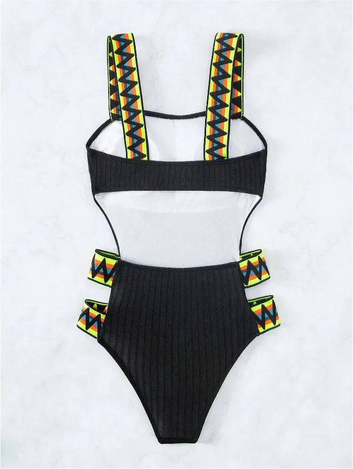 Solid colour women's one-piece swimsuit on a hanger, available in black and orange.