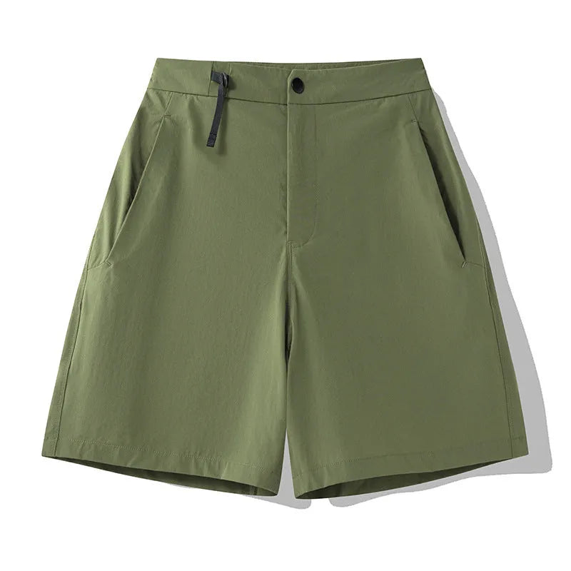 Man wearing khaki quick-drying sports shorts with an elastic waistband for running or climbing.