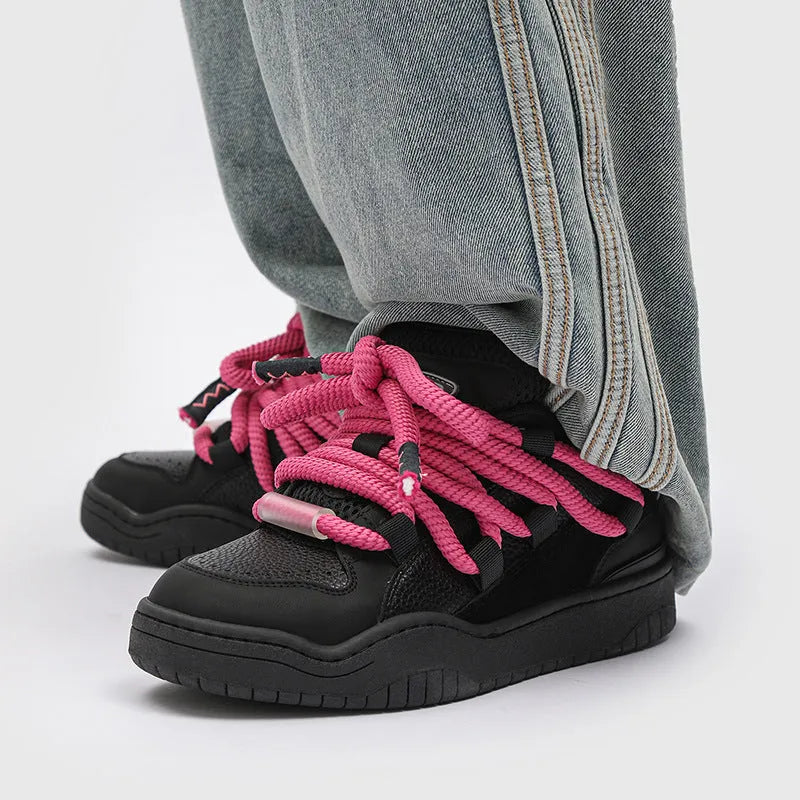 Unisex casual lace-up shoes with thick rubber soles in denim blue colour showing round toe and low-top design