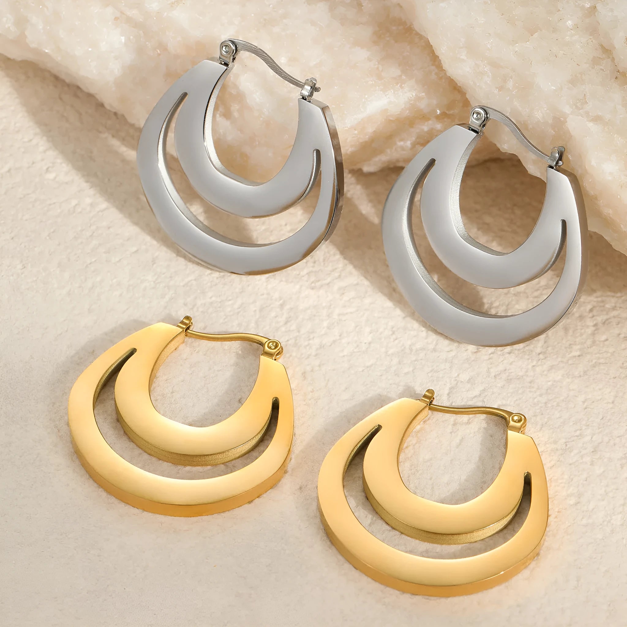 Geometric gold-plated French earrings with stainless steel construction and round ring design elements