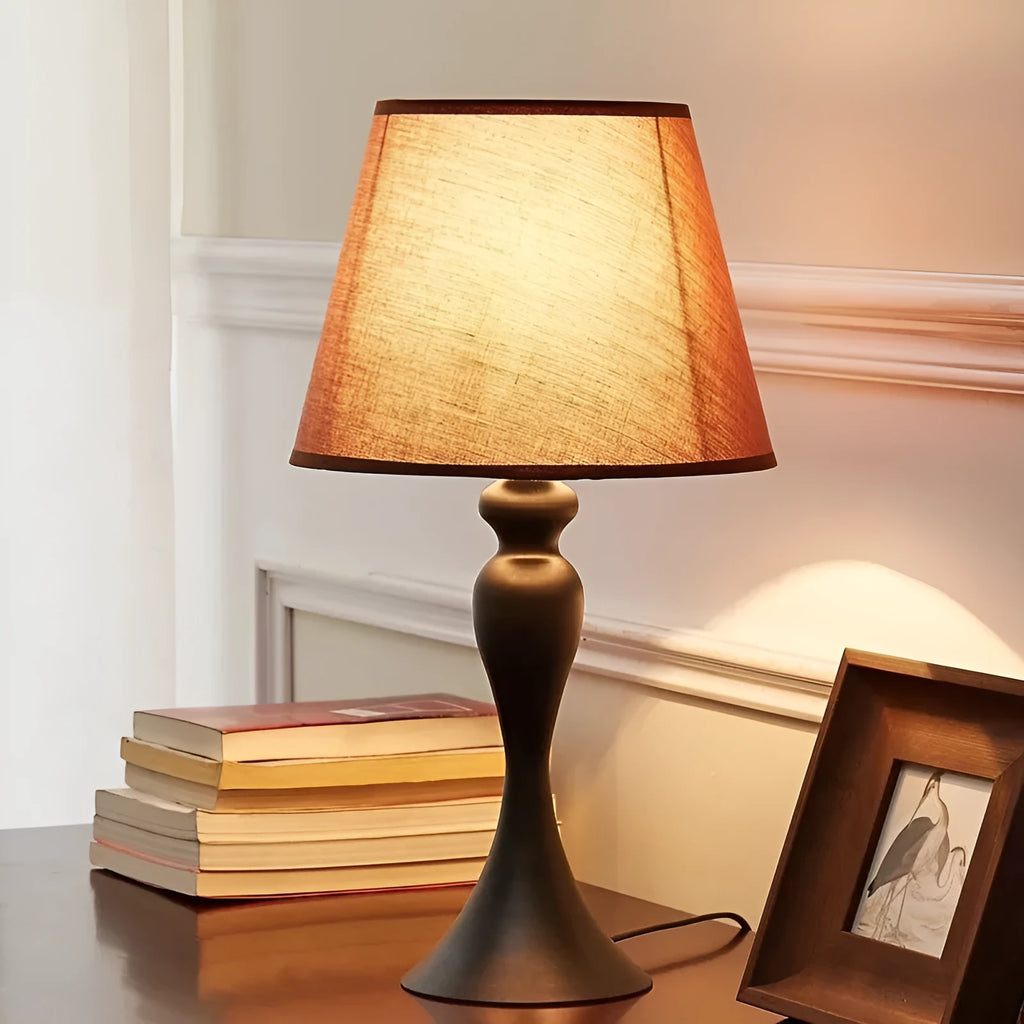 Retro alloy LED bedside lamp with speaker design and button controls on wooden table