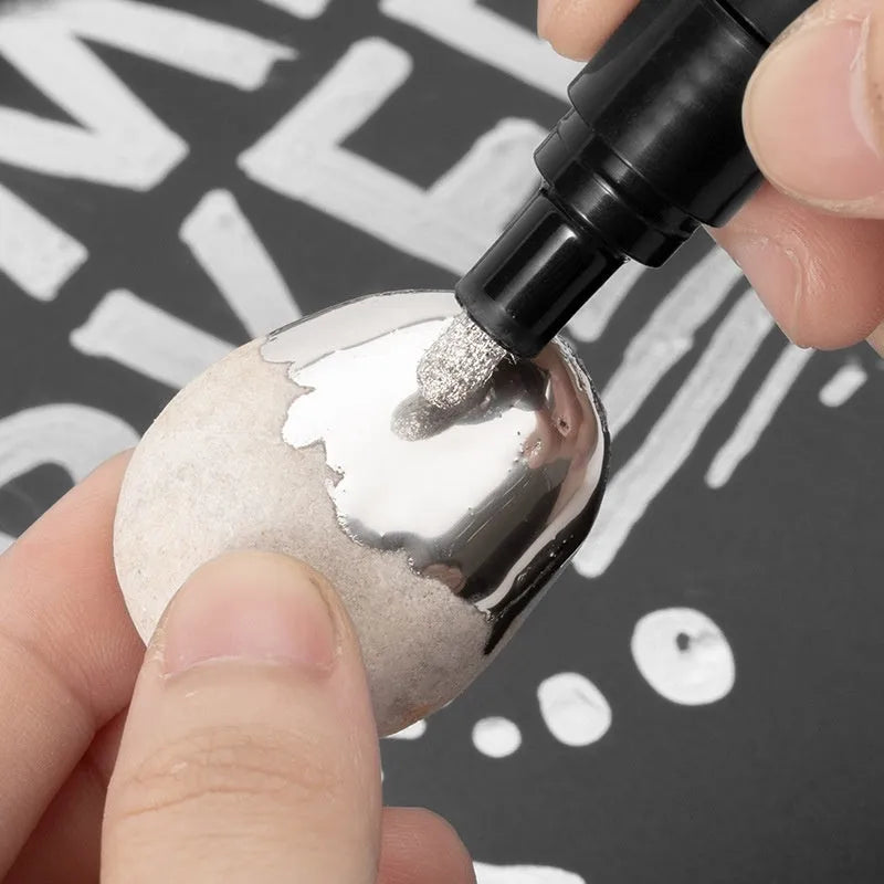 A plastic-bodied waterproof marker pen for writing on glass and mirrors, shown with a choice of 1mm or 2mm nib tip.