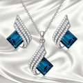 Women's necklace and earring set with cross chain design in alloy and glass with electroplated finish