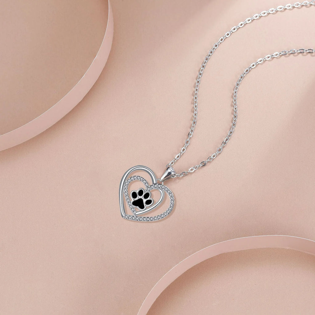 Women's necklace with a copper heart-shaped dog's paw pendant on a cross chain