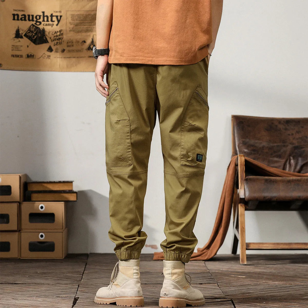 Men's tapered harem pants in cotton fabric showing ankle banded design and small leg opening