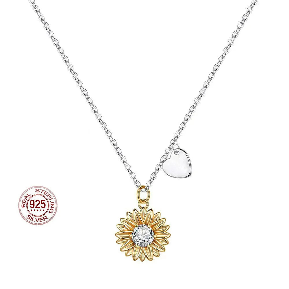 925 sterling silver sunflower daisy pendant on an adjustable cross chain necklace.