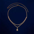 Gold or silver rhinestone waist chain with water drop pendant and tassel elements, showing lobster clasp closure