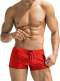 Men's black high waist swimming trunks with a front lace-up closure on a plain background.