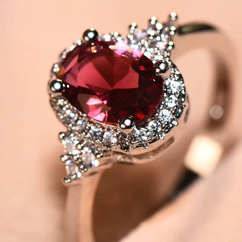 Adjustable oval ruby ring with copper open-mouth band, white gold colour finish, sizes 6 to 10