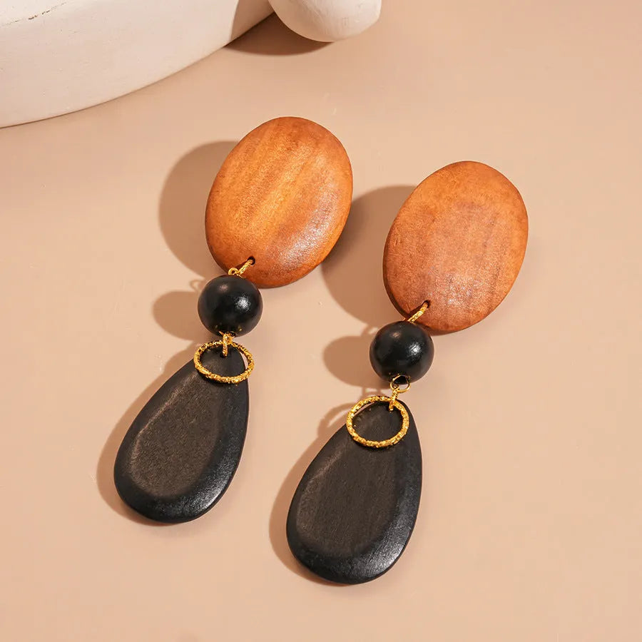 Brown-black wooden retro earrings with elliptical shape and silver needle European American style