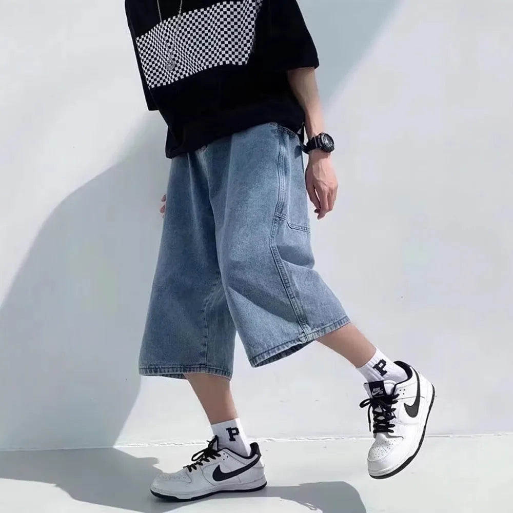 Blue men's cropped high waist denim pirate shorts on a neutral background
