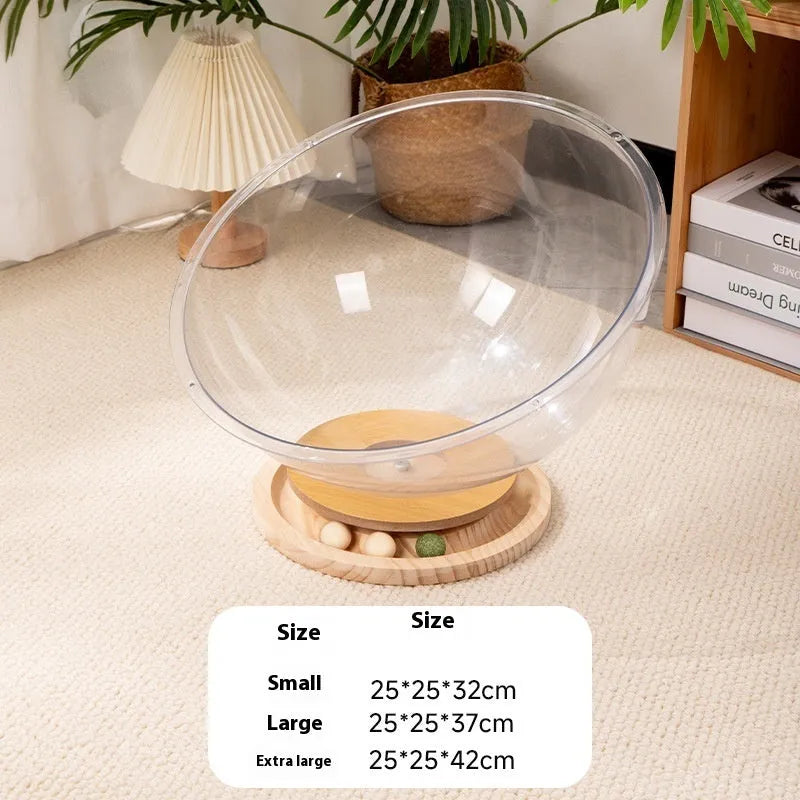 Transparent acrylic cat space capsule bed on a wooden base, showing its bathtub-style design.