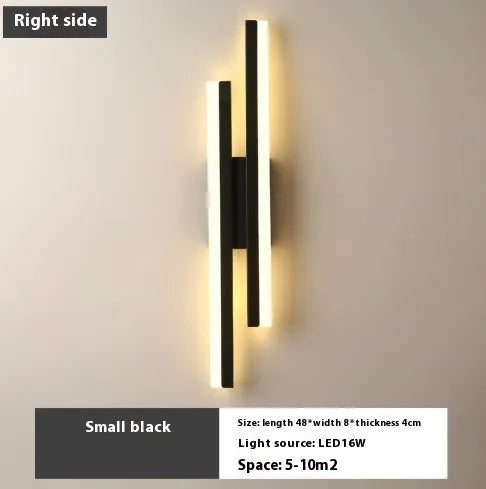 Scandinavian minimalist LED wall light with an acrylic shade on a black arm, mounted on a light-coloured wall.