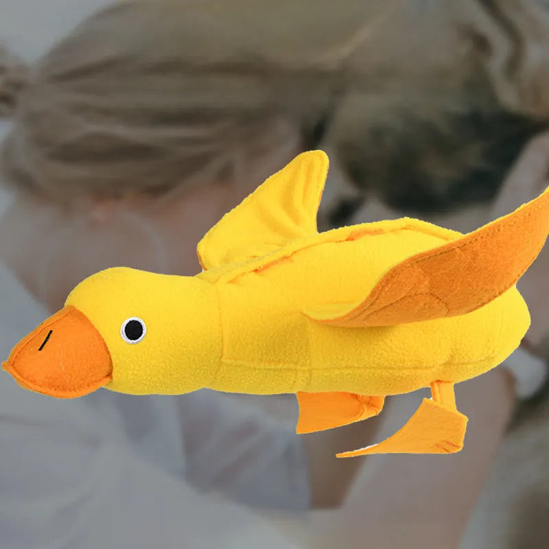 Yellow plush teddy dog toy with a duck squeaker and hidden treat pockets for training and chewing