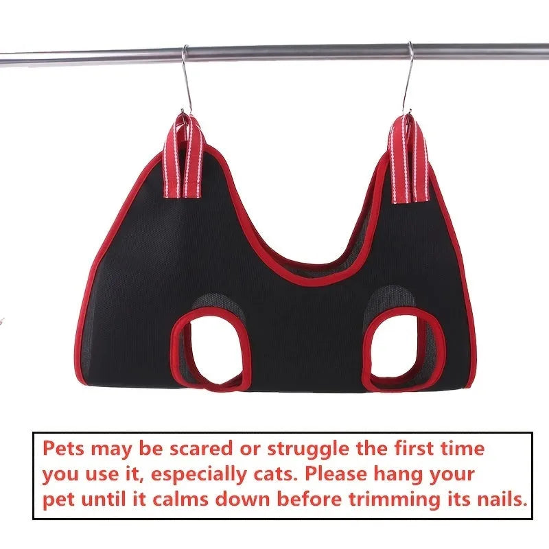 A pet grooming hammock restraint bag hanging, suitable for cats and small dogs.
