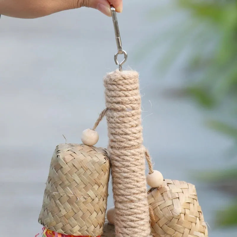 Colourful shredded paper parrot toy with wood and sisal construction measuring 15cm by 35cm