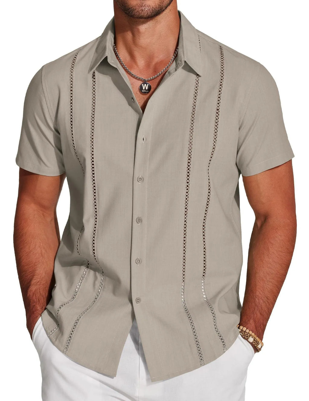 Man wearing a slim fit, short sleeve printed Hawaiian shirt in elastic polyester fabric.