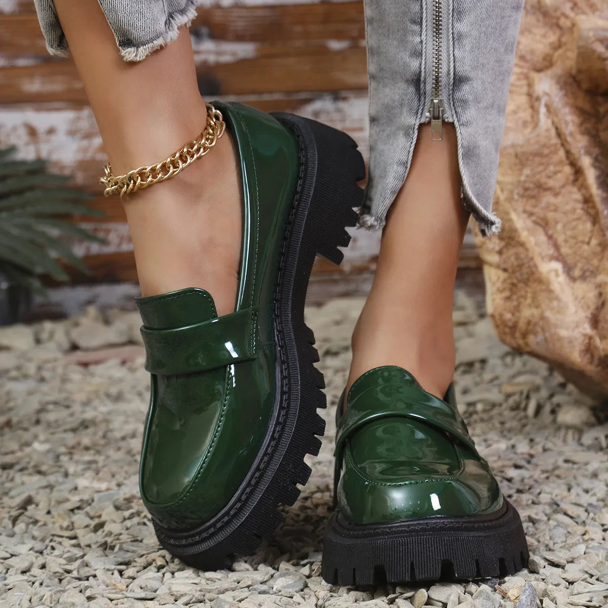 Plus size women's black slip-on loafers with a chunky mid-heel platform and rubber sole