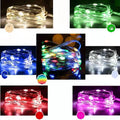 12-metre copper wire LED string lights with 120 bulbs arranged in garden setting