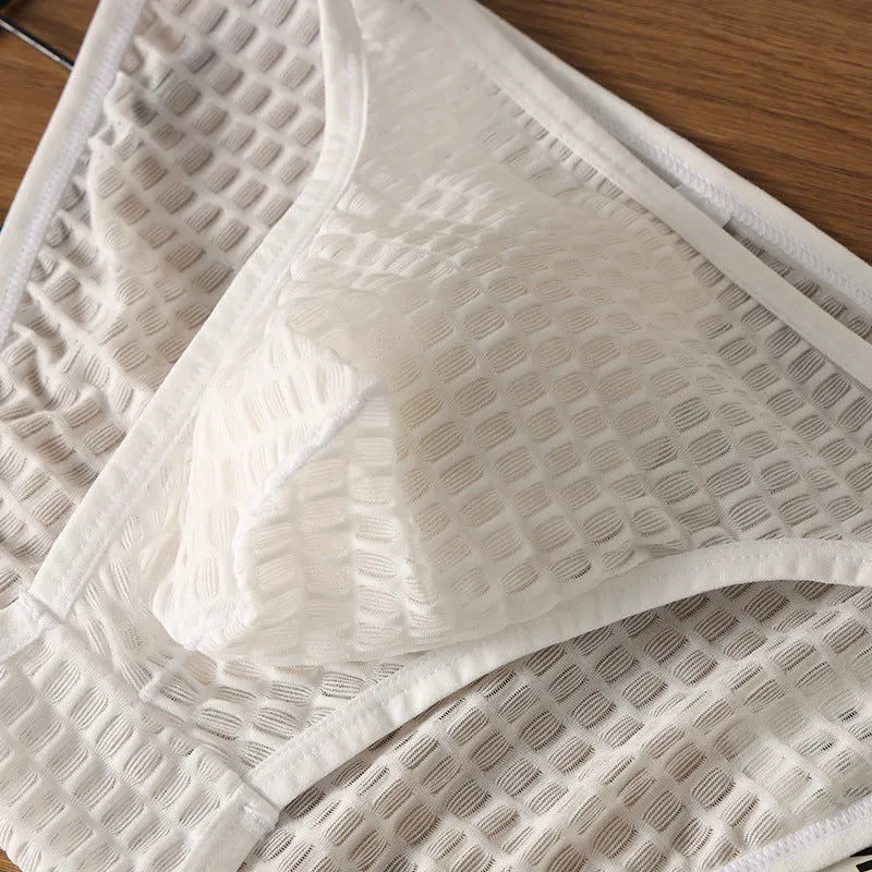 Men's low waist lace underwear in black on a white background