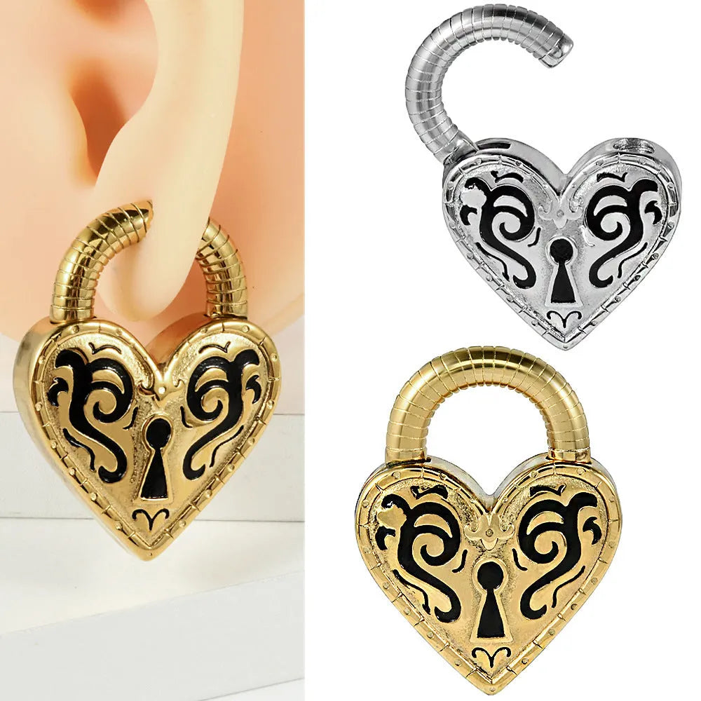 Women's heart-shaped stainless steel earrings in gold or steel colour options for ear piercings