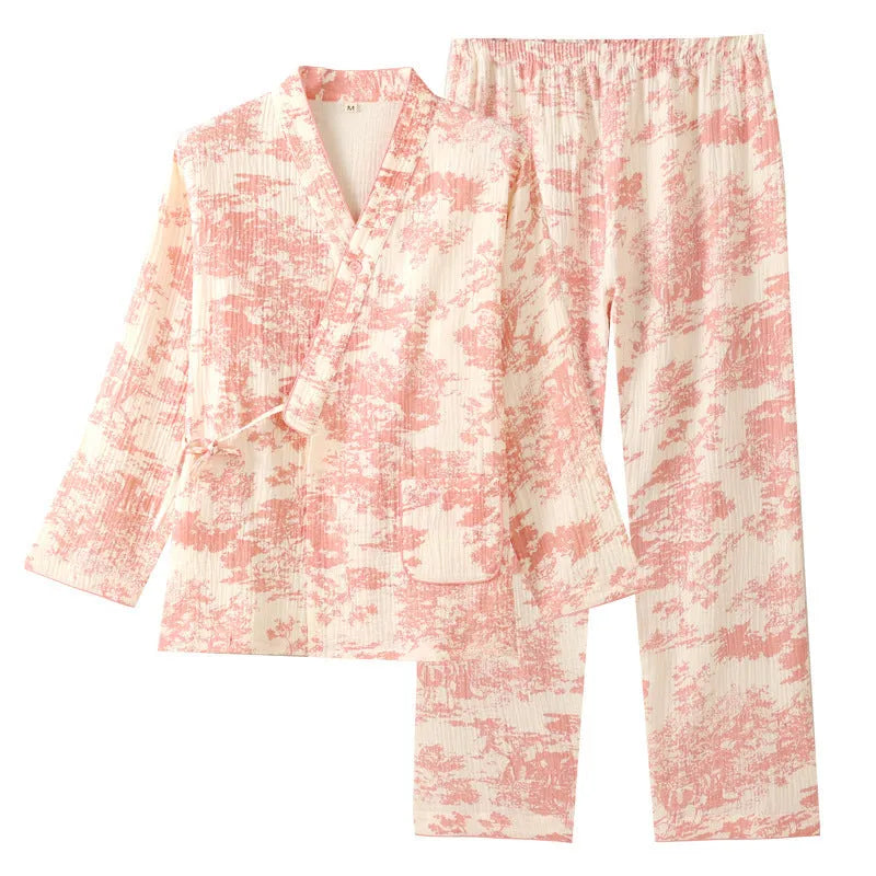Women's pink pure cotton gauze long sleeve lounge suit with matching trousers on a hanger.