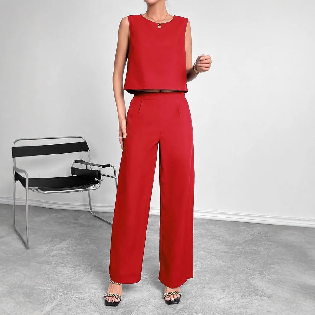 Women's red polyester two-piece set with sleeveless round neck top and wide leg trousers displayed together