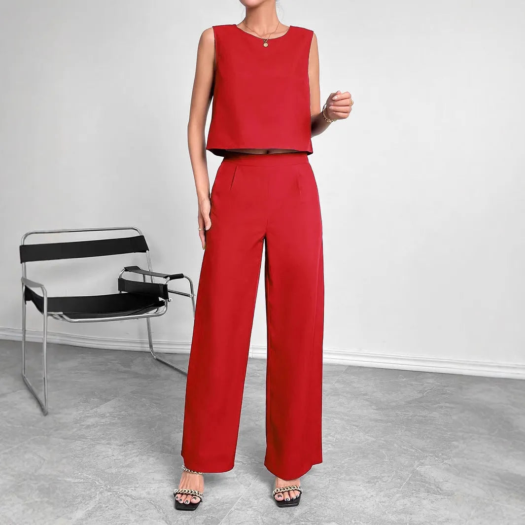 Women's red polyester two-piece set with sleeveless round neck top and wide leg trousers displayed together