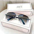 Gold frame aviator-style metal driving sunglasses with resin lenses for UV protection.