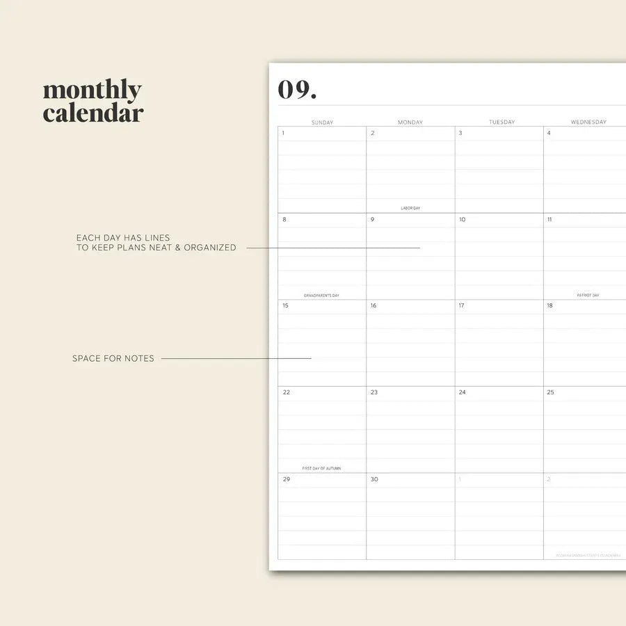 Cherry red coil-bound daily schedule notebook with spiral binding open on a desk
