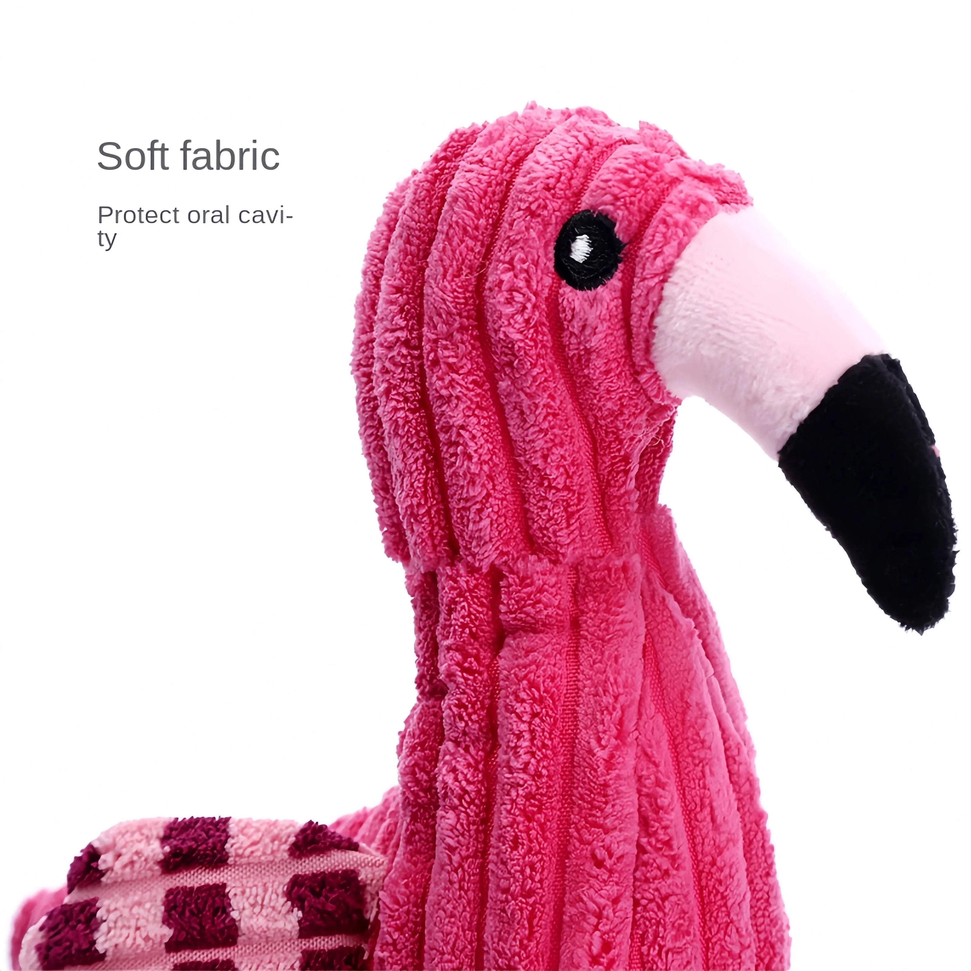 Pink animal-shaped corduroy plush dog toy with squeaker on a white background