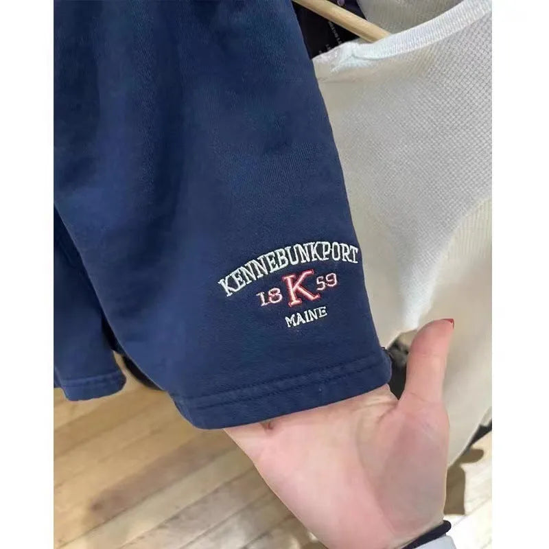 Women's dark blue cotton sports shorts with white flag embroidery and navy blue styling