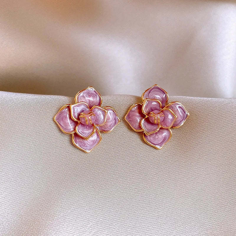 Gold plated purple oil-spot glaze floral stud earrings on copper base.