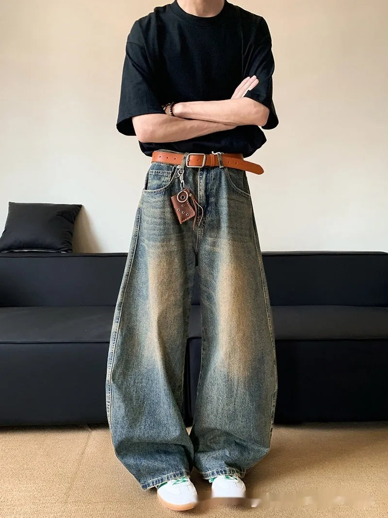 Men's retro blue distressed denim jeans with slim wide-leg cut and micro stretch fabric