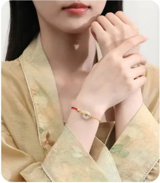 Gold electroplated Koi Peace Buckle Hetian Jade Red Rope Bracelet with safety clasp and animal zodiac design