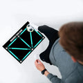 Black rectangular football training mat measuring 60cm by 90cm with non-slip surface