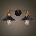 Black iron industrial-style wall lamp with two adjustable heads in a retro design