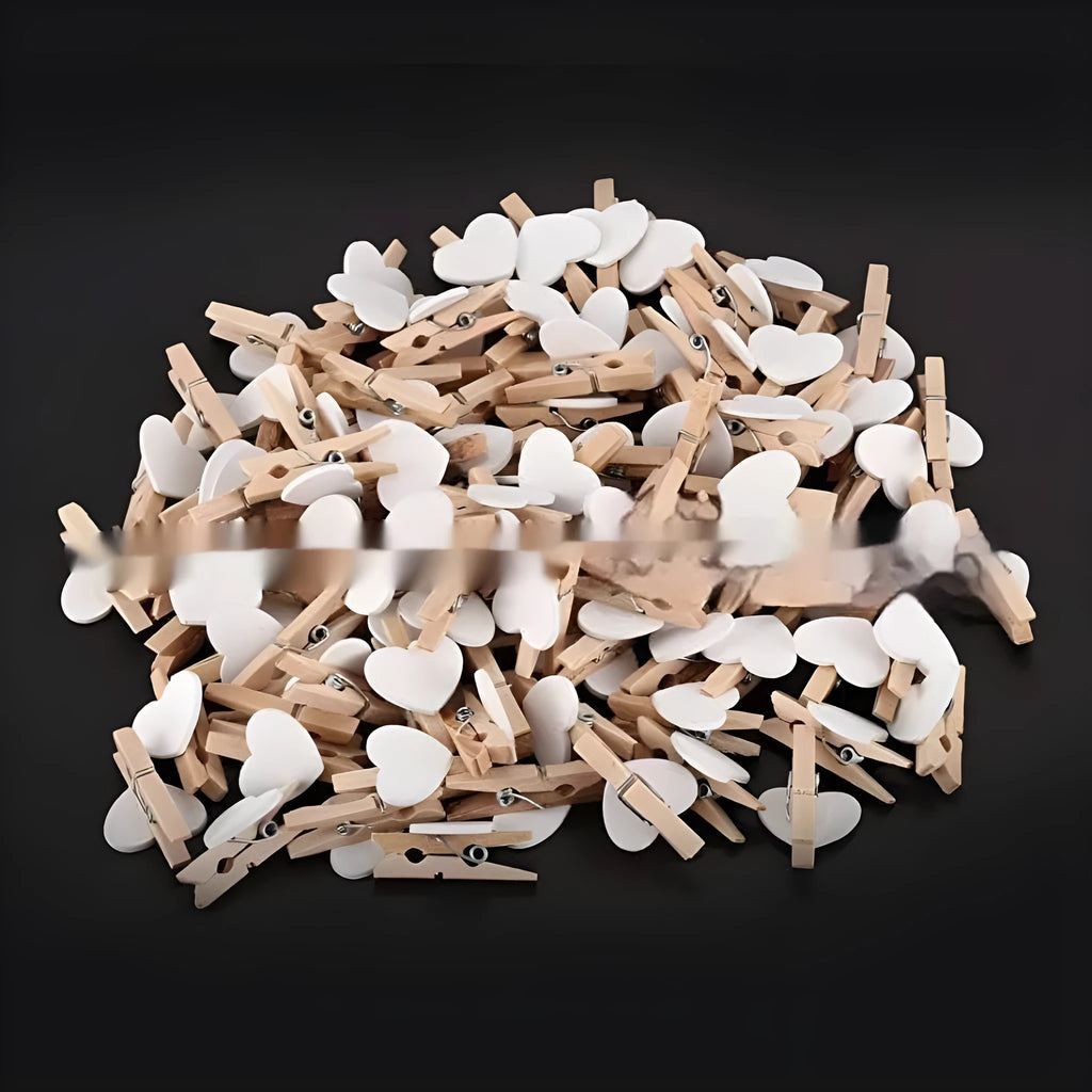 Five small handmade solid wood heart-shaped clips in red, rose red, and white colours.