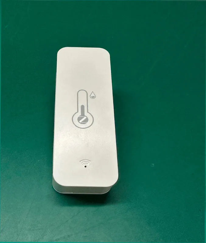 Compact white ABS plastic WiFi temperature and humidity sensor with measurement display