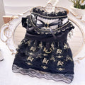 Golden gothic princess style skirt for a small dog on a mannequin, showing the size tag.