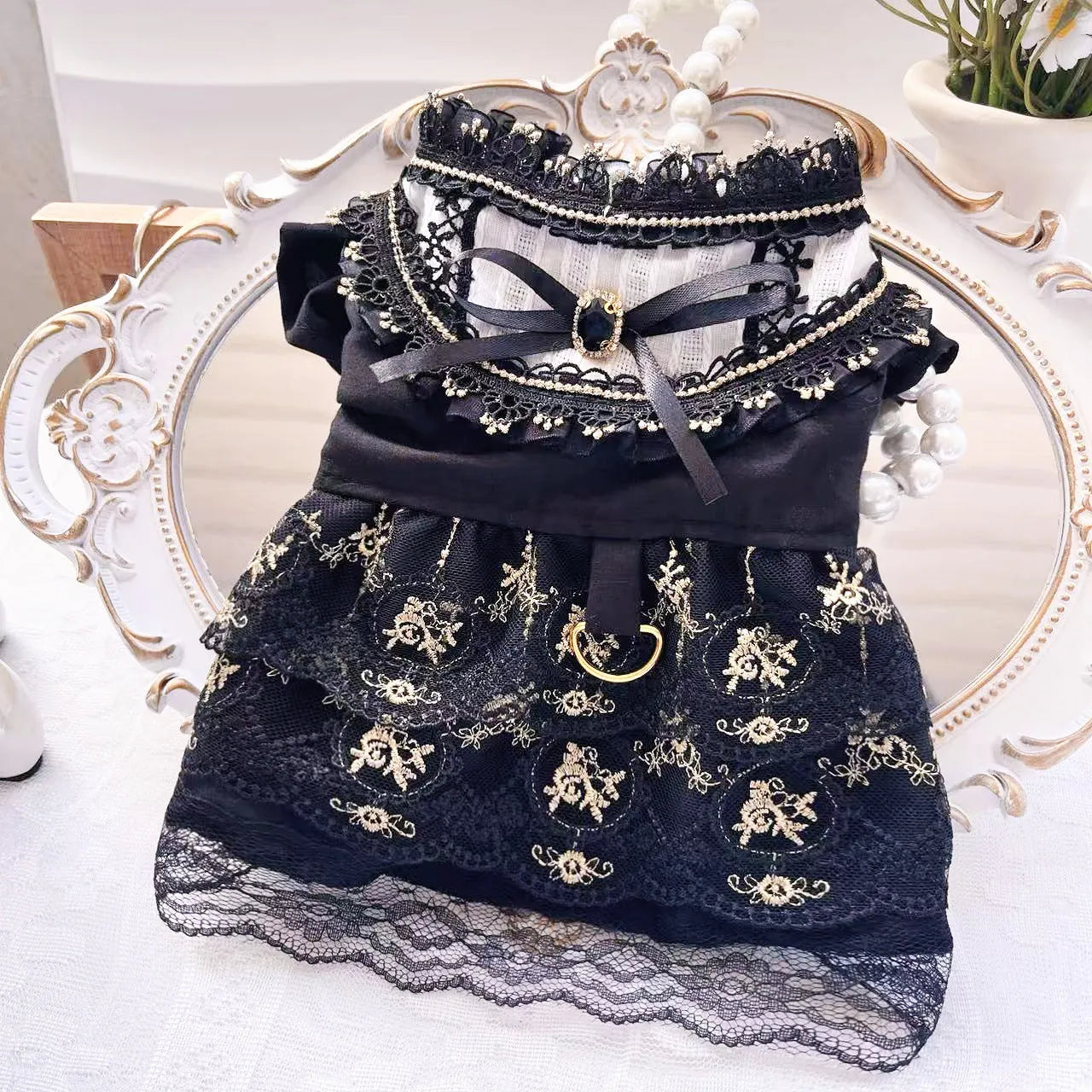Golden gothic princess style skirt for a small dog on a mannequin, showing the size tag.