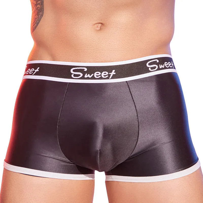 Man wearing shiny silky black nylon boxers, a pair of men's breathable underwear