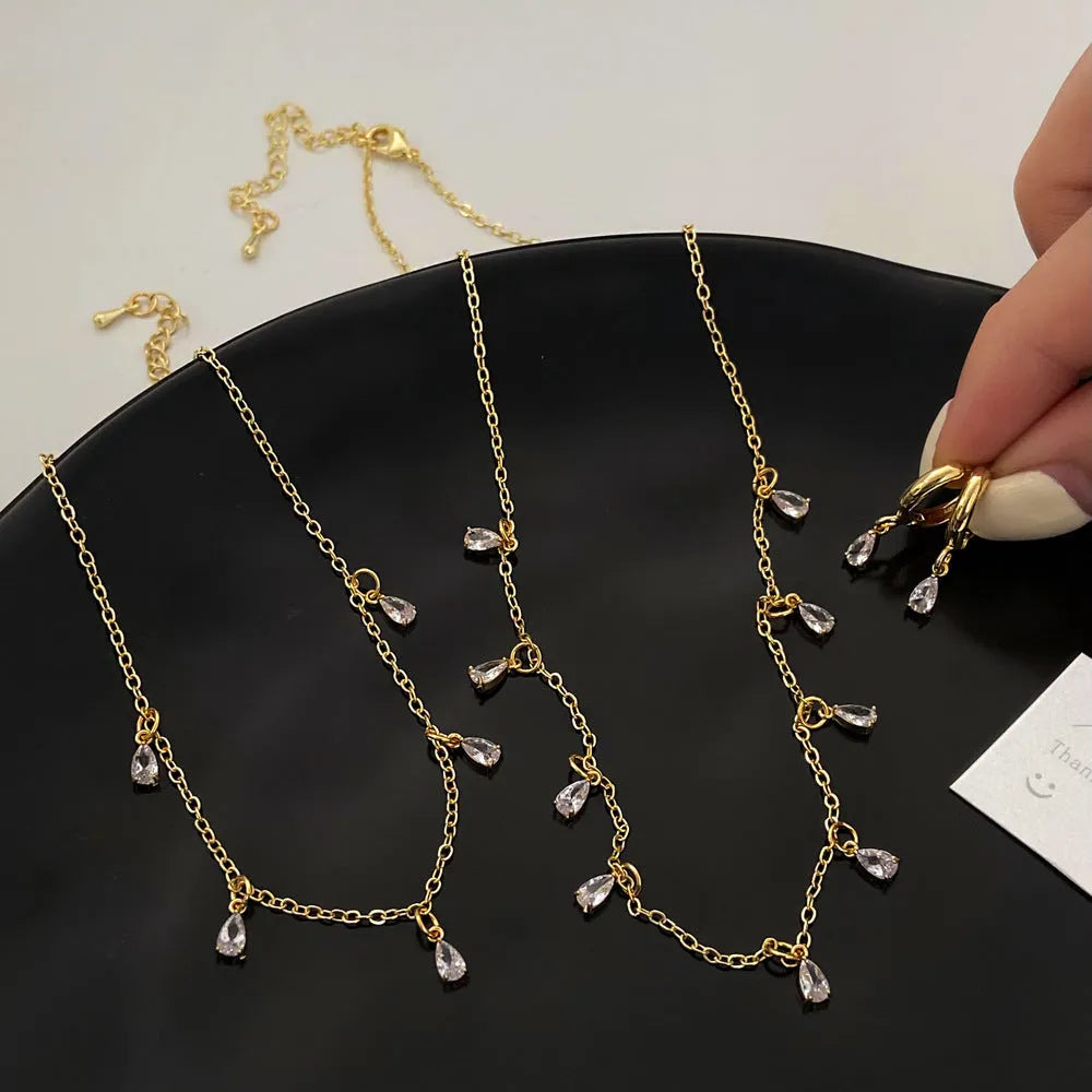 Women's zircon jewellery set showing necklace, earrings, and anklet with geometric meteor shower design