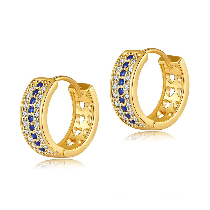 Round geometric women's earrings with copper construction and 18K gold electroplated finish.