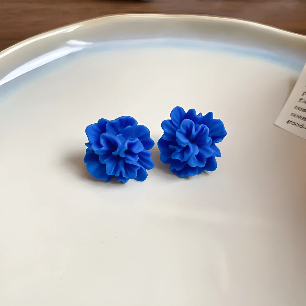 Women's geometric earrings with cloth base and silver needle-blue resin flower accents