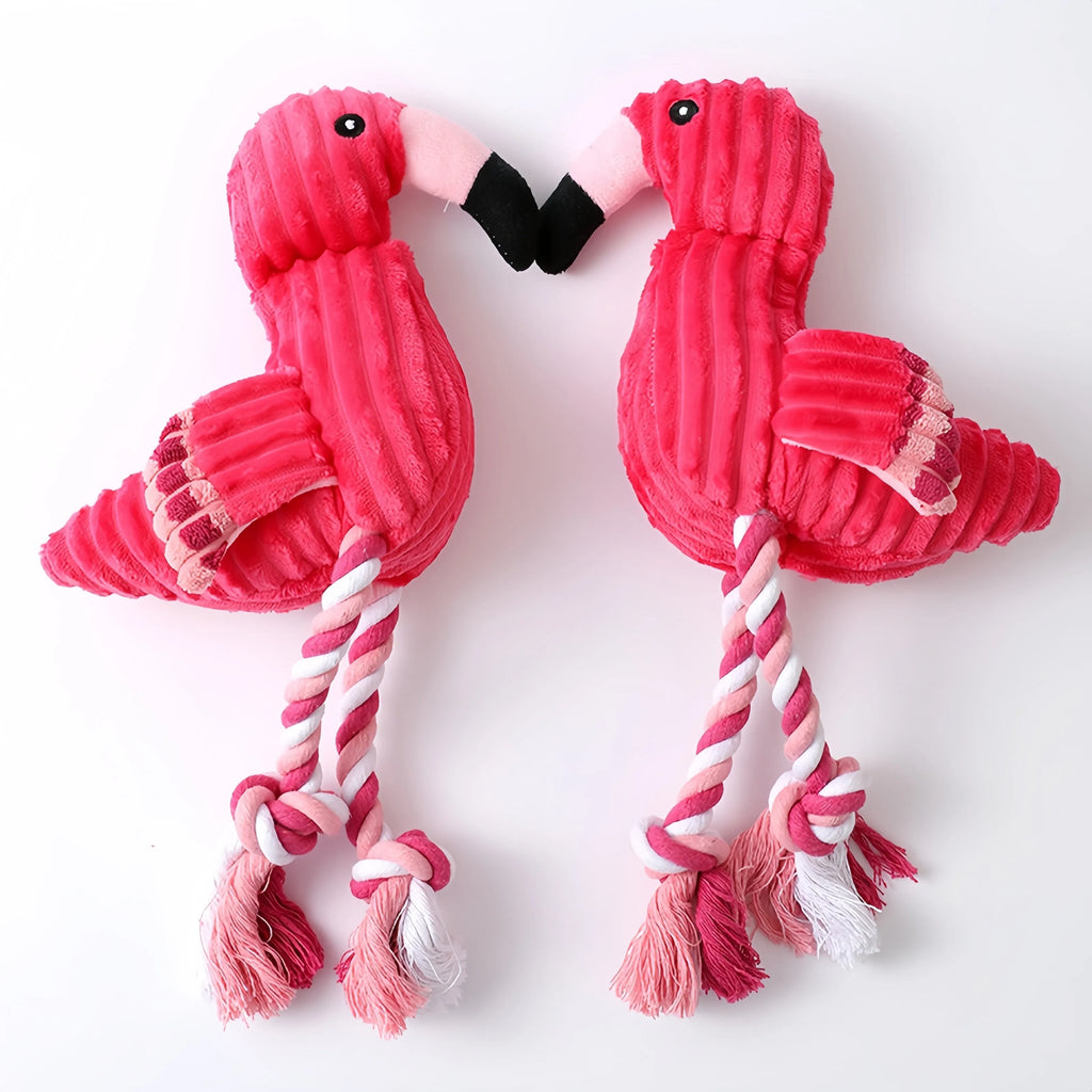 Pink animal-shaped corduroy plush dog toy with squeaker on a white background