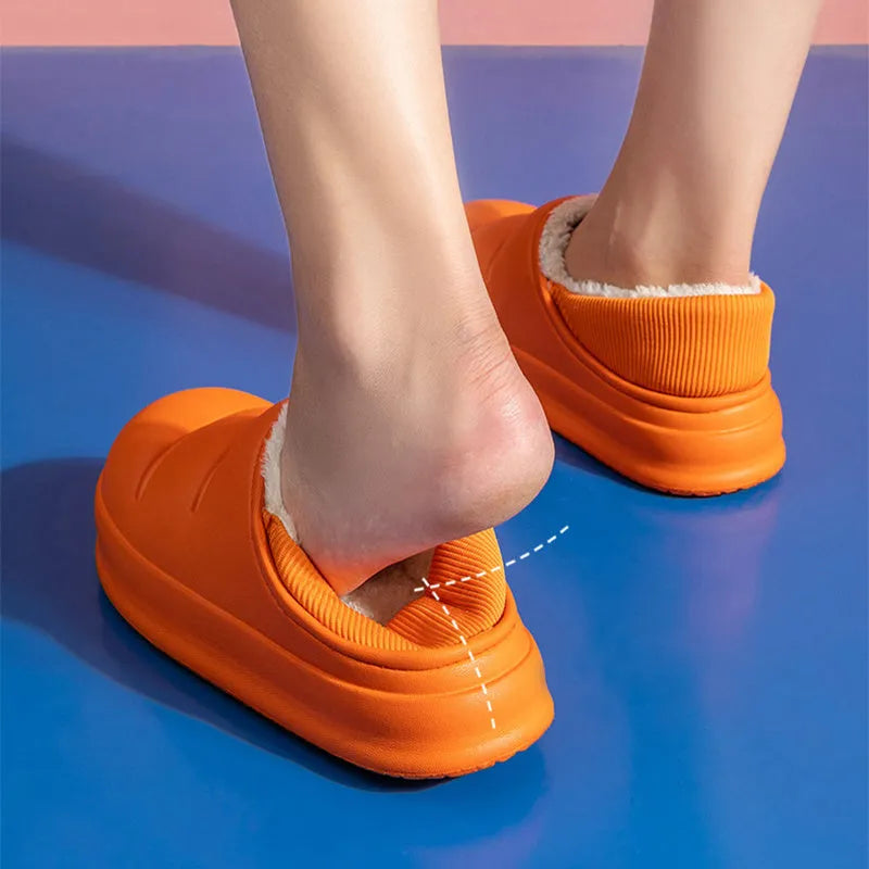 Waterproof EVA garden slippers in green with a plush lining and non-slip sole.