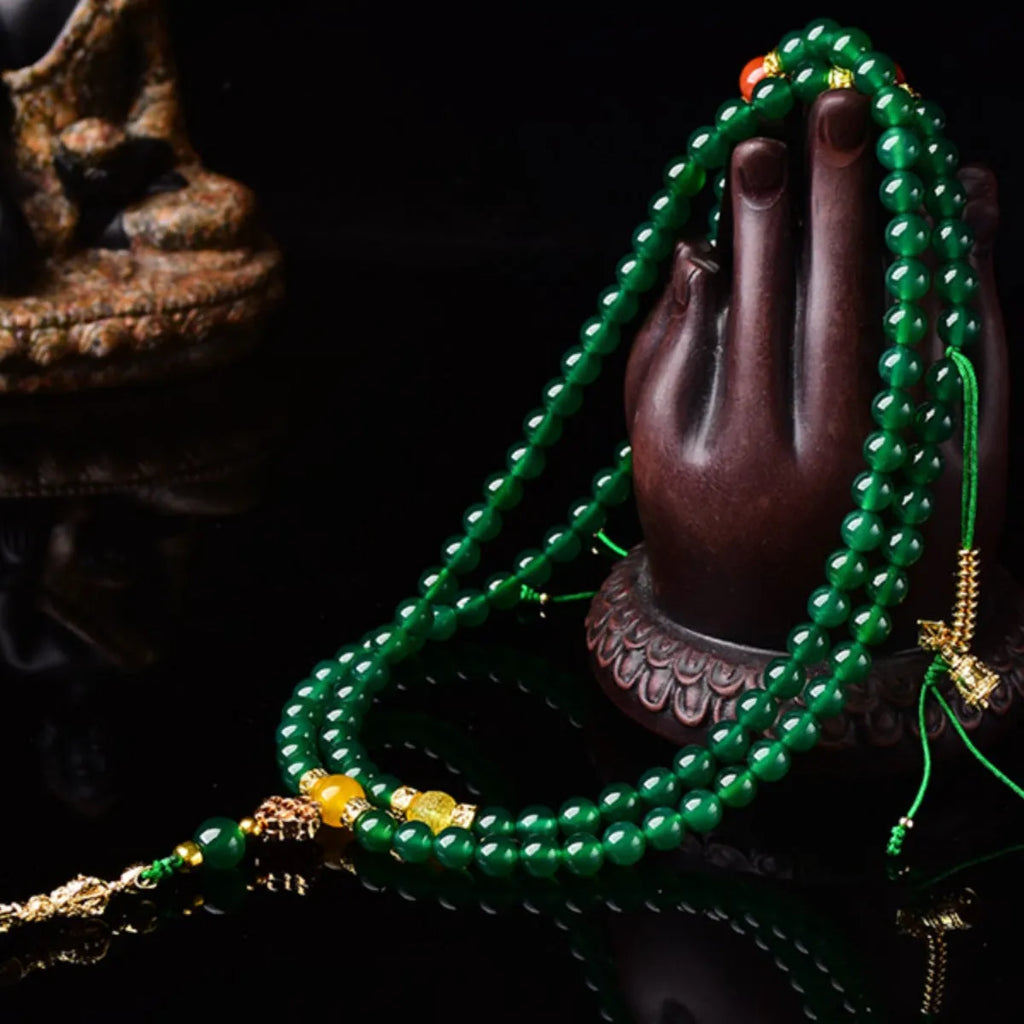 Handmade multi-circle bracelet with green agate beads from Brazil, shown in unisex styling.